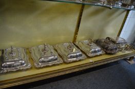 A good set of four plated entree dishes and covers together with another similar and related items.