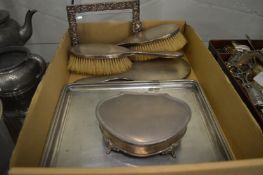 A silver rectangular dressing table tray with set of three matching brushes and similar trinket