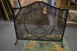 A wrought iron spark guard.