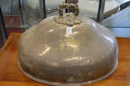 A large plated meat dome with engraved armorial together with a smaller meat dome.
