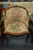 A French style armchair with carved show wood frame.