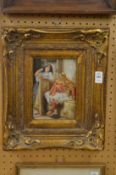 Arab scene with two figures conversing, oil on panel, in a decorative gilt frame.