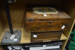 A 19th century rosewood writing box with decorative folding top, another box and a lamp.
