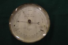 L Cassella, London, an aneroid barometer.
