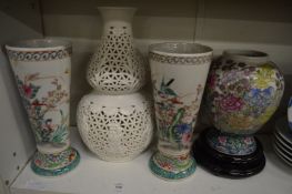 A pair of Chinese vases and two other vases.