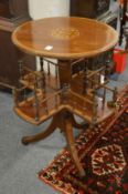 A good Edwardian inlaid mahogany and satinwood banded occasional table with revolving galleried book