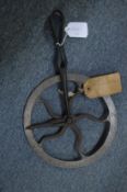 An unusual wrought iron measuring device.
