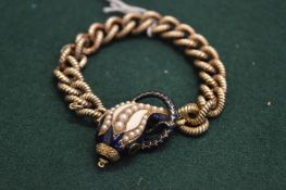 A good silver bracelet with snake design, executed in enamel, pearl and ruby.