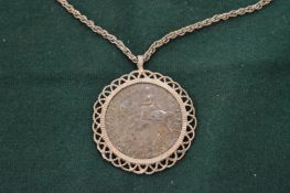 Large coin with silver mount.