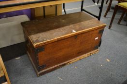 A pine trunk, a child's rocking chair and a painted hanging cupboard decorated with a chicken.