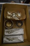 A small group of silverware and other items.