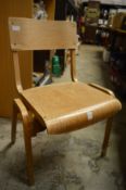 A set of ten stylish bentwood chairs with plywood backs and seats.