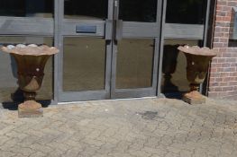 A good large pair of cast iron urns.