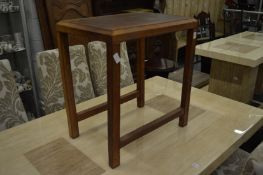 A leather covered occasional table.
