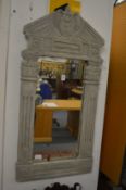 In the manner of William Kent, a carved wood pier mirror with later painted decoration.