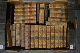 A box of leather bindings and other books.