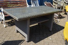 A glass top garden table.