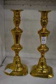 A pair of brass candlesticks.