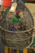 A parrot in a cage.