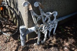 A pair of cast aluminium bench ends.
