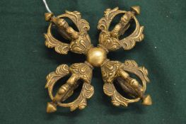 A Tibetan bronze double vajra.