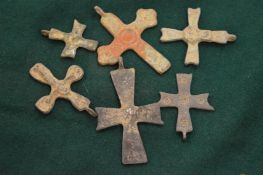 A group of bronze crucifix's.