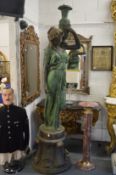 A large and impressive pair of patinated bronze figural fountains or lamps, each modelled as a