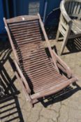 A hardwood reclining garden chair.