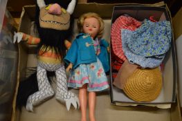 A Wild Things soft toy and a doll with accessories.