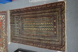 A Persian prayer rug 136cm x 81cm.