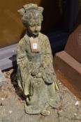 A reconstituted stone garden ornament modelled as a seated Chinese female figure.