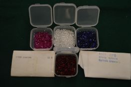 Four small boxes of spinels.