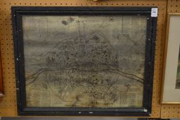 An unusual map of Paris on a mirrored ground in an ebonised frame.