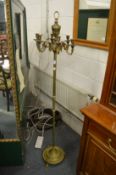A brass floor standing six branch candelabra.