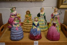 An unusual collection of seven Goss porcelain models of ladies.