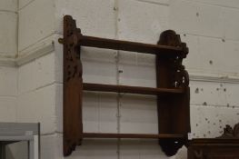 A set of walnut wall shelves.