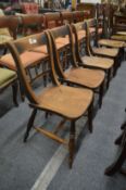 A set of four 19th century beech and elm kitchen chairs.