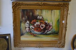 Still life of flowers in a bowl, oil on board, in a decorative gilt frame.