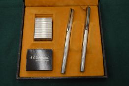 A Dupont gift set comprising cigarette lighter, fountain pen and ballpoint pen, boxed.