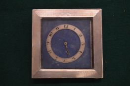 A silver desk clock (faults).