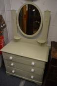 A green painted three drawer dressing chest.