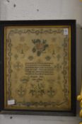 A framed and glazed sampler by Elizabeth Hall aged 10 years, dated 1828.