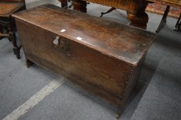 An 18th century oak six plank coffer.