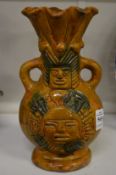 A Mexican style pottery twin handled vase.