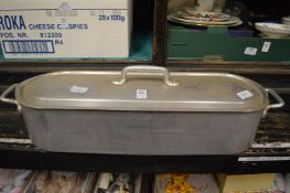 An aluminium fish kettle.