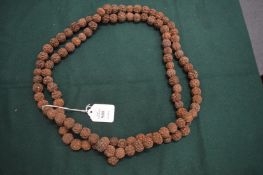 A large nut necklace.