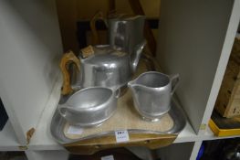 A Picquot Ware tea service comprising, tea pot, hot water jug, milk jug, sugar basin and tray.