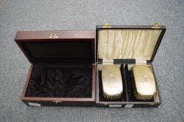 A cased pair of silver backed gentleman's brushes and a silver mounted box.