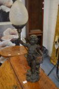 A figural spelter table lamp.