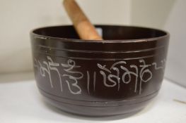 An Eastern bronze singing bowl.
